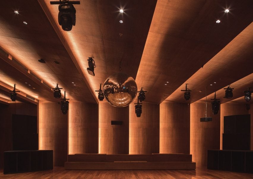 A disco ball with a diameter of one meter hangs above the sprung dance floor