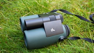 Binoculars Swarovski AX Visio 10x32 on grass