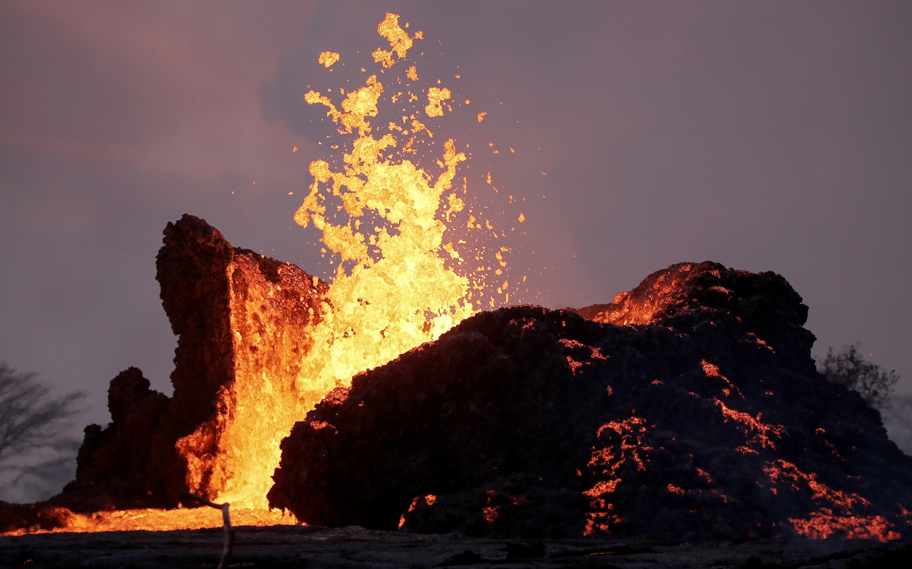 PHOTO: Lava erupts and flows from a fissure at Kilauea Volcano in Leilani Estates, Hawaii's Big Island, on May 23, 2018 in Pahoa, Hawaii.