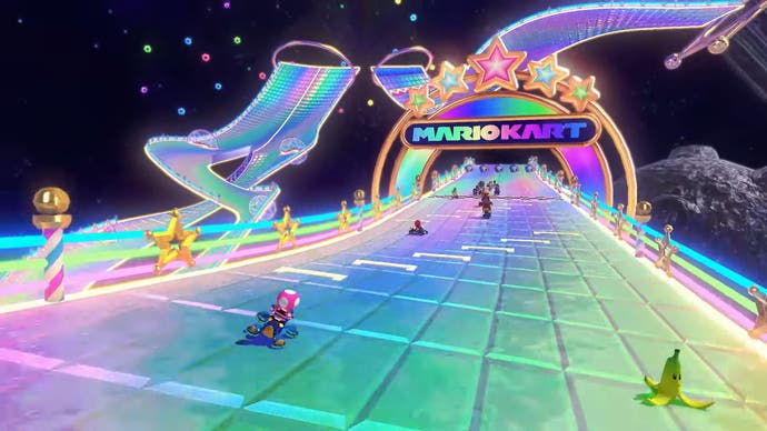 Wii Rainbow Road screenshot from Mario Kart 8 Deluxe DLC with Toadette racing to the finish line