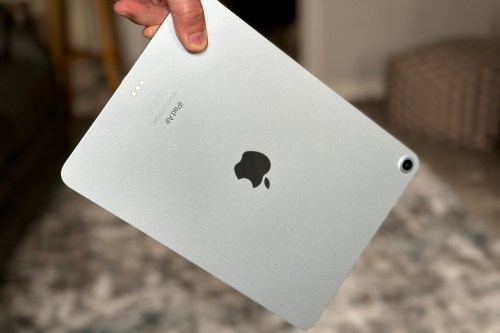 A person holding an iPad Air M2.