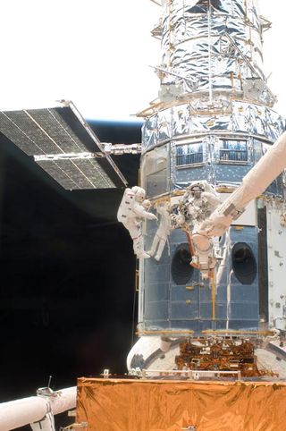 A close-up view of the metal-wrapped spacecraft.  Astronauts operate it.