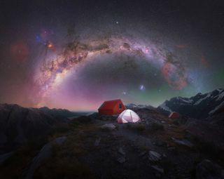 The arc of the Milky Way photographed above a lone camping tent at the summit of Aoraki/Mt Cook National Park, New Zealand