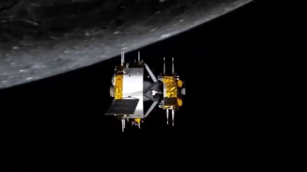 Two spacecraft are seen in this simulation near the moon, connected to one another.