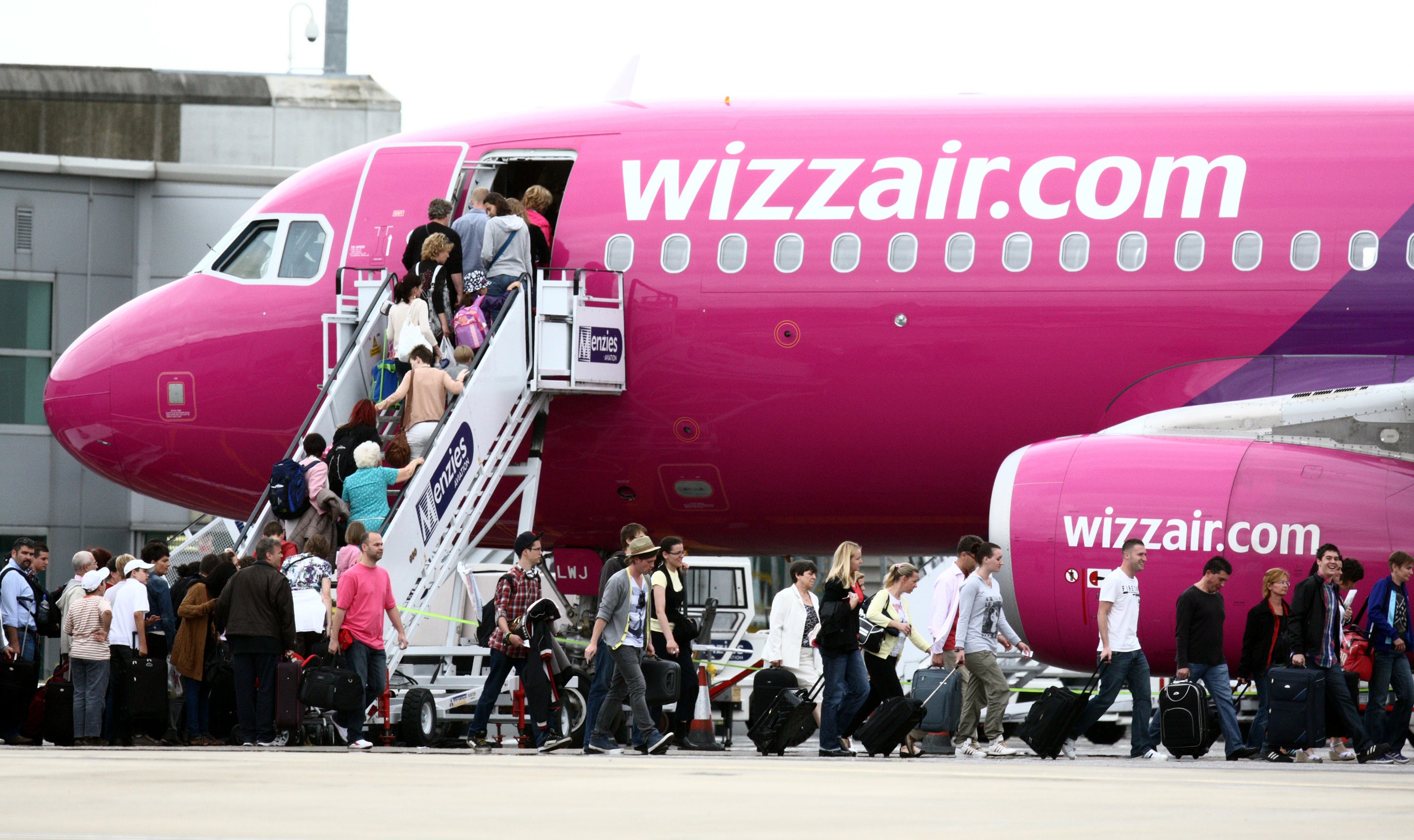 Passengers boarding a Wizz Air plane at Luton Airport