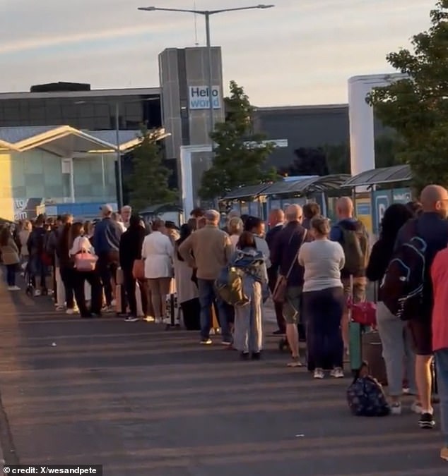 Long queues outside Birmingham Airport can be seen in a video posted on X on Sunday