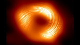 A bright orange ring with bright swirls of light on a dark background