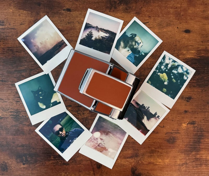 A vintage instant camera lies on a wooden surface, surrounded by nine Polaroid photos.  The images include nature scenes, a cat and a person wearing sunglasses, depicting a nostalgic and eclectic assortment of moments captured on film.