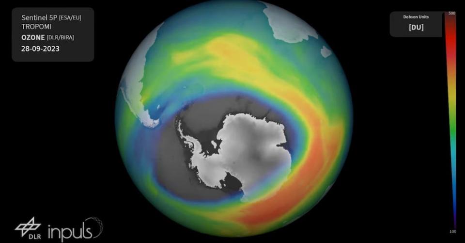 A still from the European Space Agency video showing a multi-color visualization of the ozone layer above the globe, with Antarctica visible through the massive hole, as of September 28, 2023.