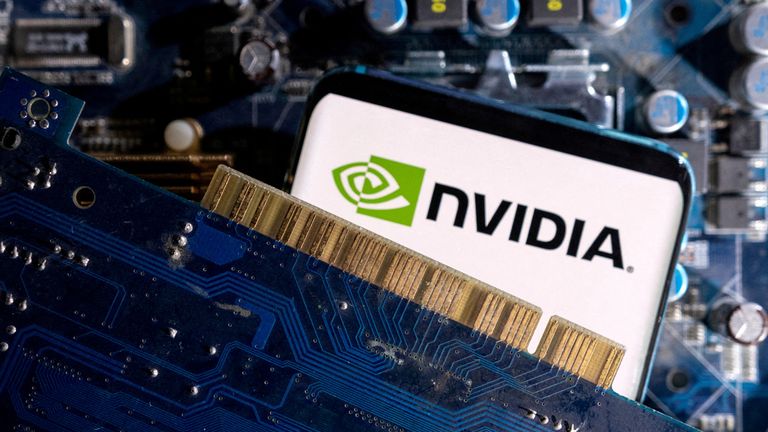 FILE PHOTO: A smartphone with the NVIDIA logo displayed sits on top of a computer motherboard in this picture taken March 6, 2023. REUTERS/Dado Ruvic/Illustration/File Photo