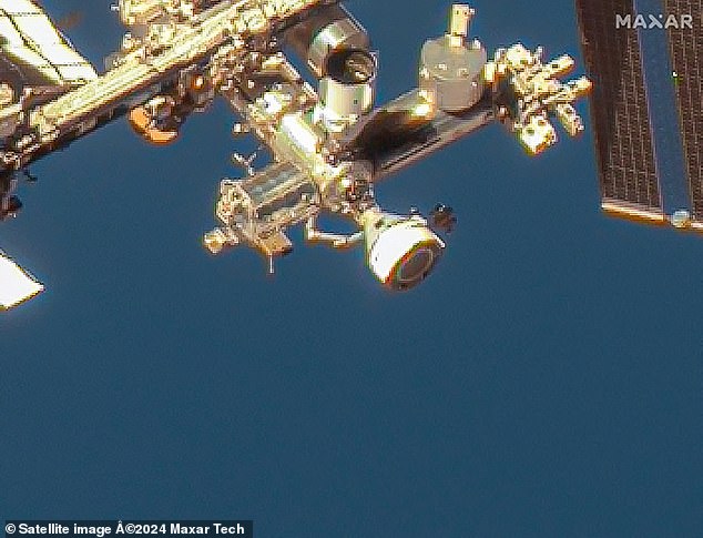 This image courtesy of Maxar Technologies taken on June 7, 2024 shows the Boeing Starliner spacecraft docked with the forward port of the International Space Station (ISS) on the station's Harmony module.  Because the Starliner is attached to the ISS, astronauts can still enter and exit the Starliner as they please