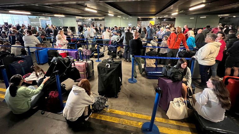 Line of passengers in front of Terminal 1. Image: Reuters