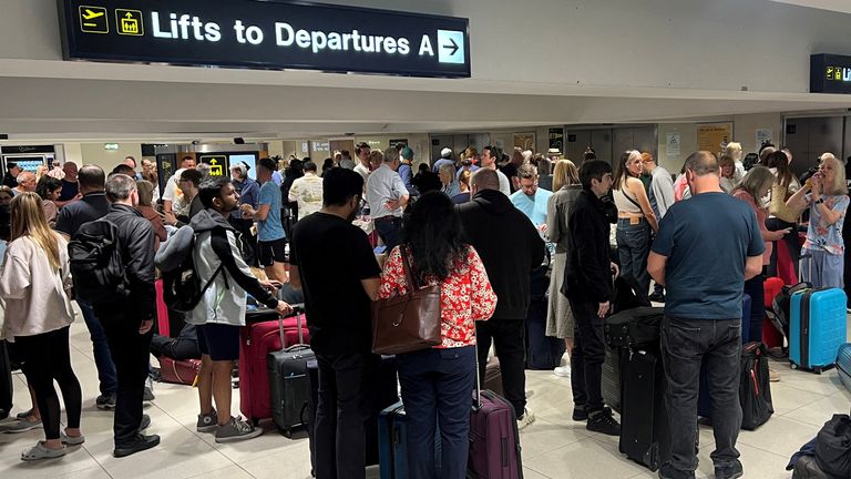 Line of passengers in front of Terminal 1. Image: Reuters