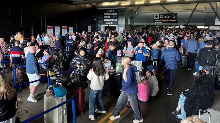 Line of passengers in front of Terminal 1. Image: Reuters