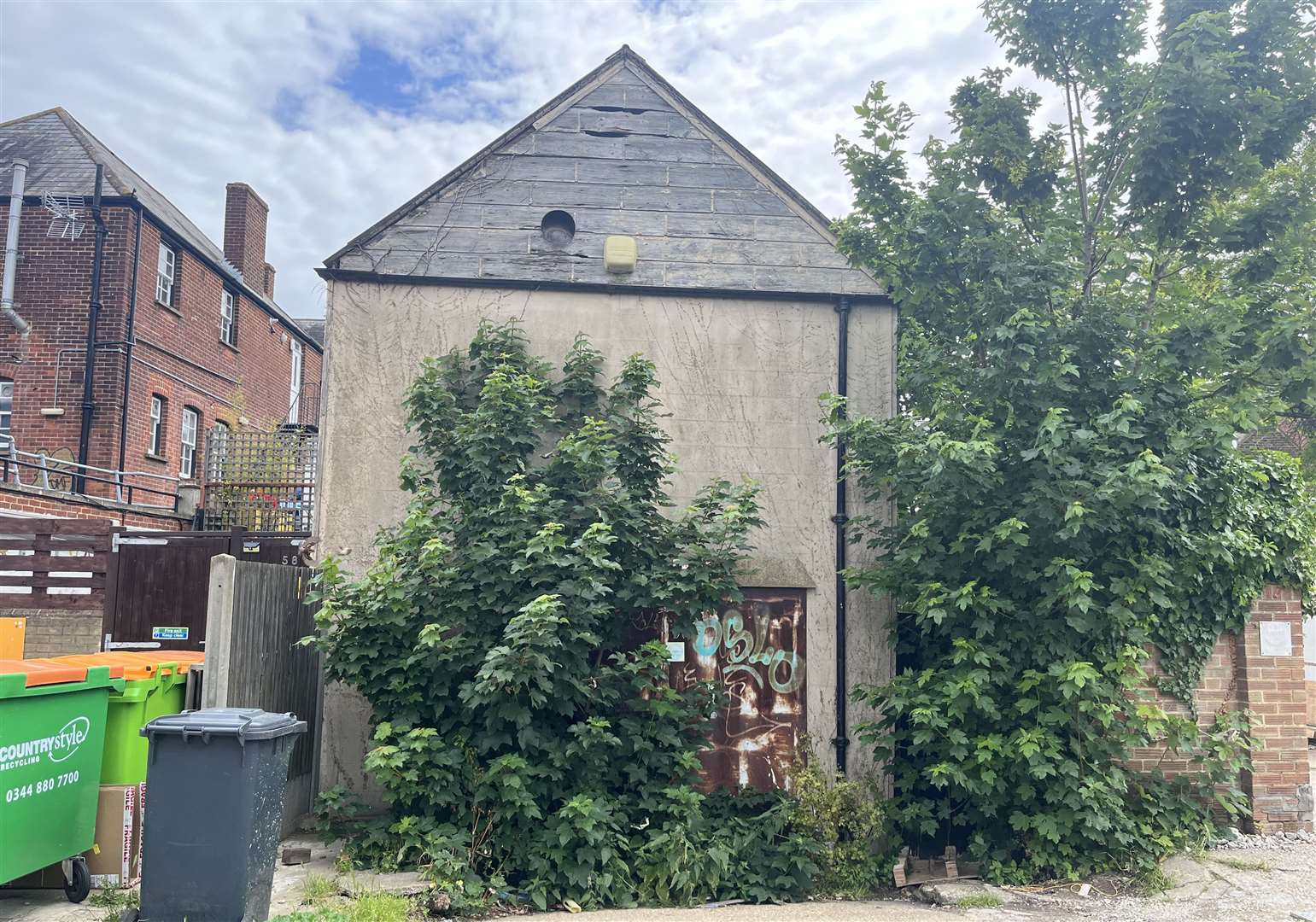 An old warehouse at the back of the site on Whitstable High Street is to be demolished as part of a proposal with three flats