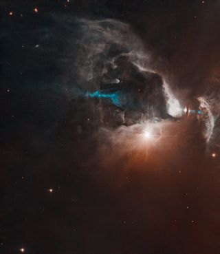 Bright point of light shines near center right with diffractive spikes, surrounded by glowing clouds against black space.  Roughly in the center of the image is a blue beam of material that is partially obscured by clouds