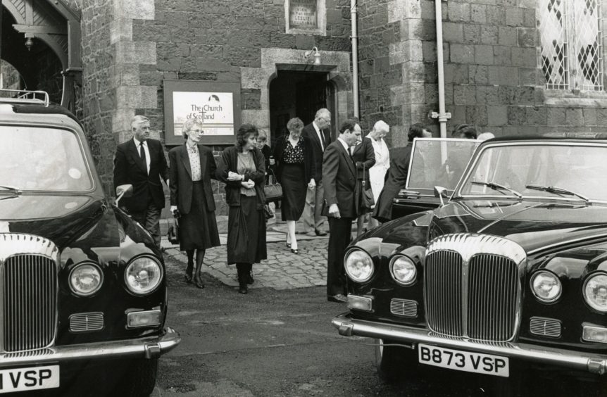 Lynda Hunter's family leaves the church after her funeral. 