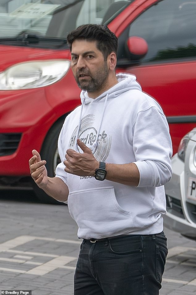 Farshad Kia, 45, (pictured) attracted numerous complaints after displaying many used cars in or next to the driveway of his 1930s semi-trailer.