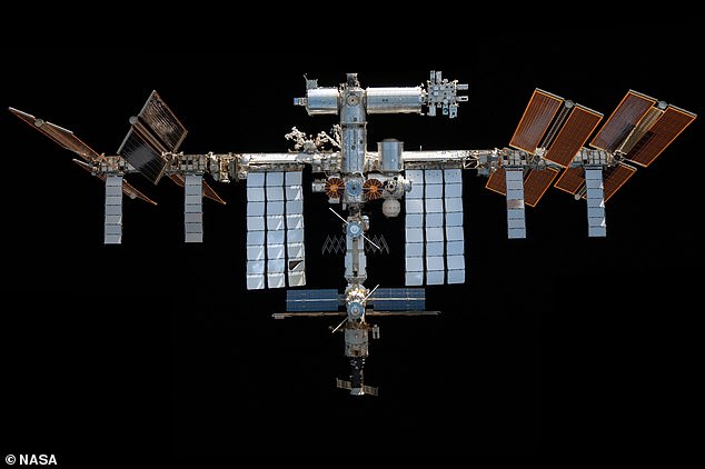 A view from below of the International Space Station (ISS) in November 2021, which maintains an orbit approximately 250 miles (400 kilometers) above Earth