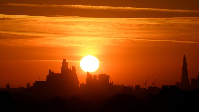 Sunrise over the London skyline as a second heatwave is forecast for parts of the country, Richmond Park, London