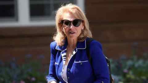 Shari Redstone wears sunglasses outside