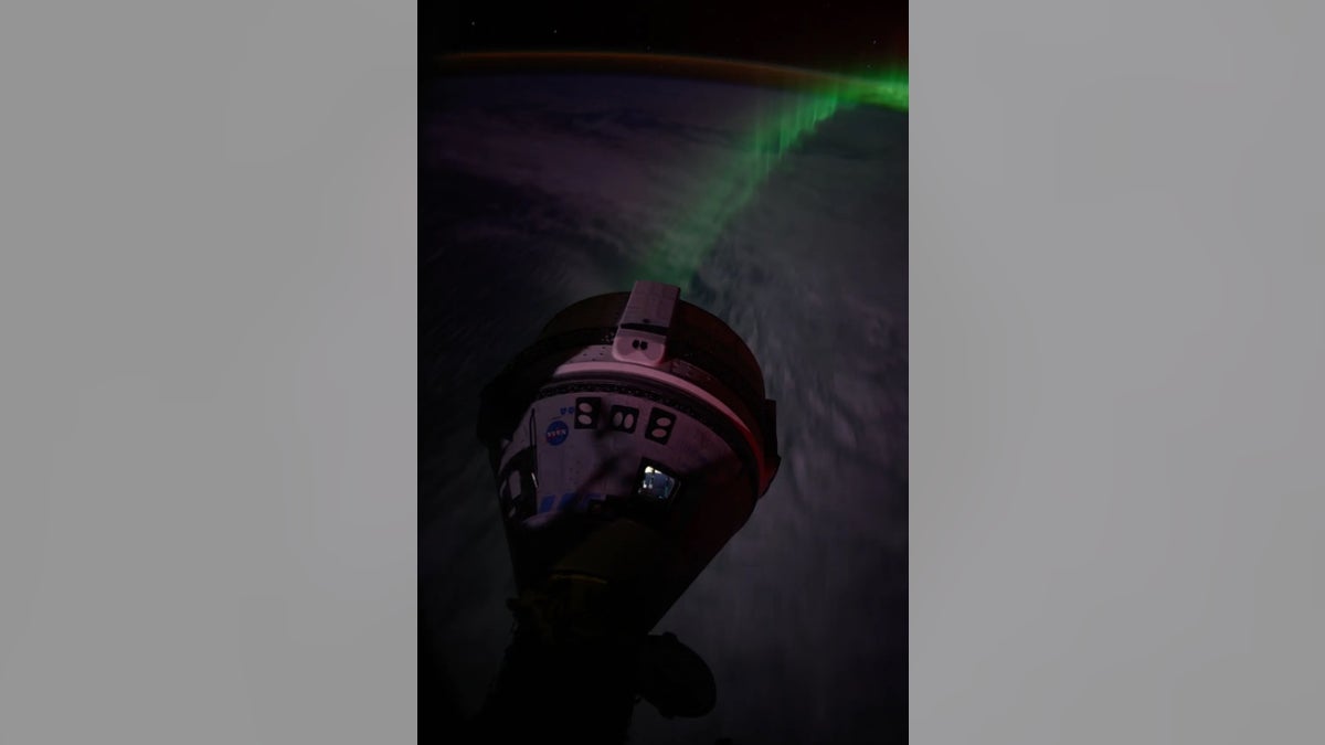 "Auroras stream below the Boeing Starliner spacecraft that docked with the forward port on the Harmony module as the International Space Station flew 266 miles over the Indian Ocean southwest of Australia," according to NASA.