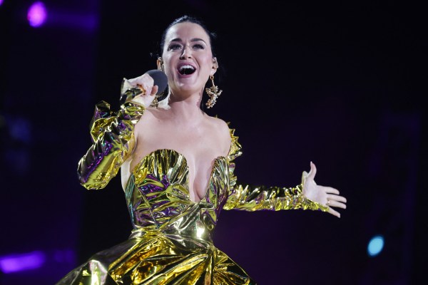 Katy Perry sings in a metallic gold dress