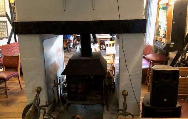 There is a two-sided wood burner that separates the front of the pub from a smaller area at the back dedicated to viewing the projection screen.