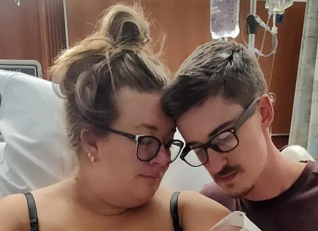 Hospital staff were unable to find her baby boy's heartbeat and an ultrasound confirmed he had died.  The couple are shown holding Matthew after his stillbirth