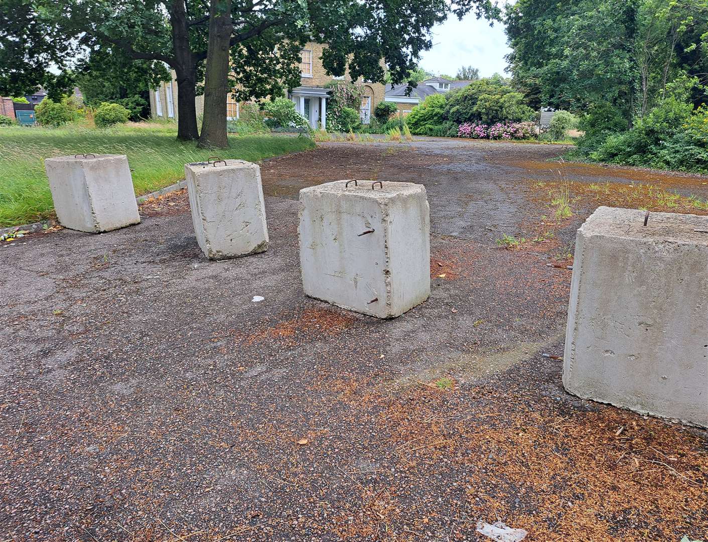 Concrete blocks block the entrance to the former Hadlow Manor Hotel