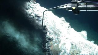 Underwater robot taking water samples for black smoker