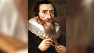 Johannes Kepler wearing a collar and black shirt and holding a mathematical compass in the painting