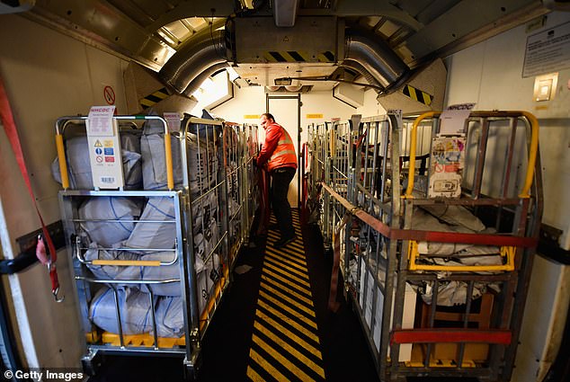 A train shown being loaded by workers in Scotland before heading south in 2016