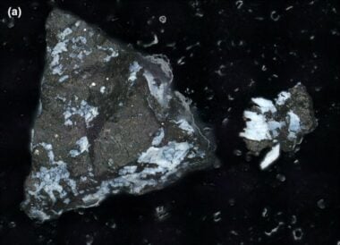 This image shows a reflective phosphate in one of the rocks in the Bennu sample.  The presence of phosphates suggests an aqueous past.  Image Credit Lauretta et al.  2024.