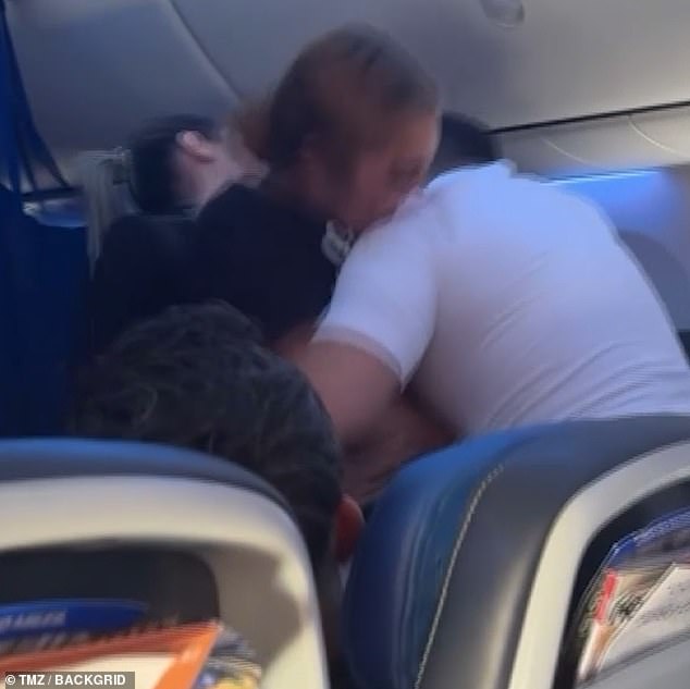 The passenger bit a piece of fabric from the flight attendant's shirt during the struggle